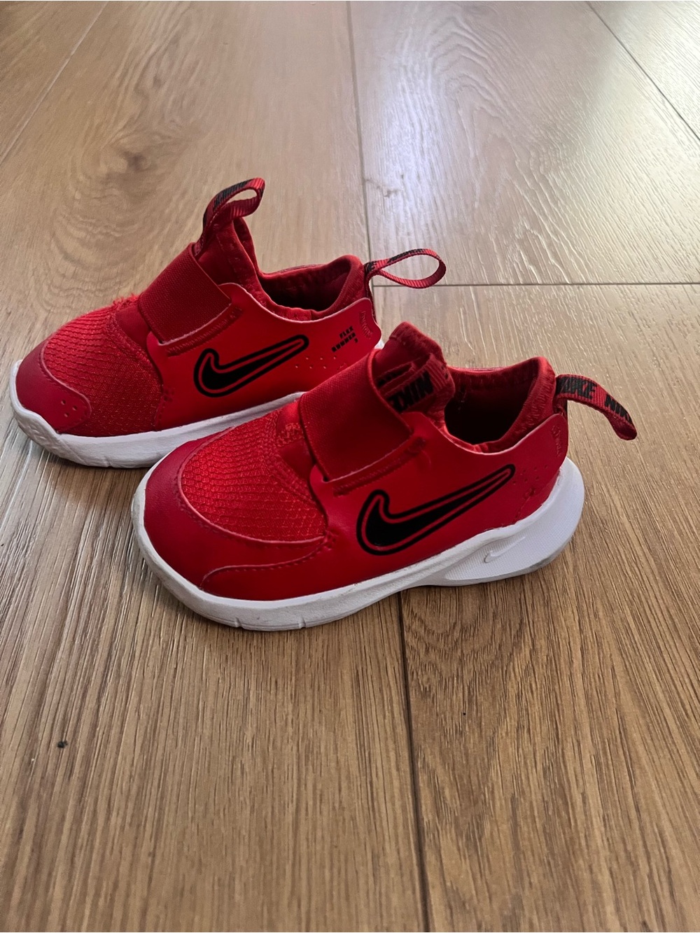 Nike Kids Red Slip-On Sneakers with Black Swoosh